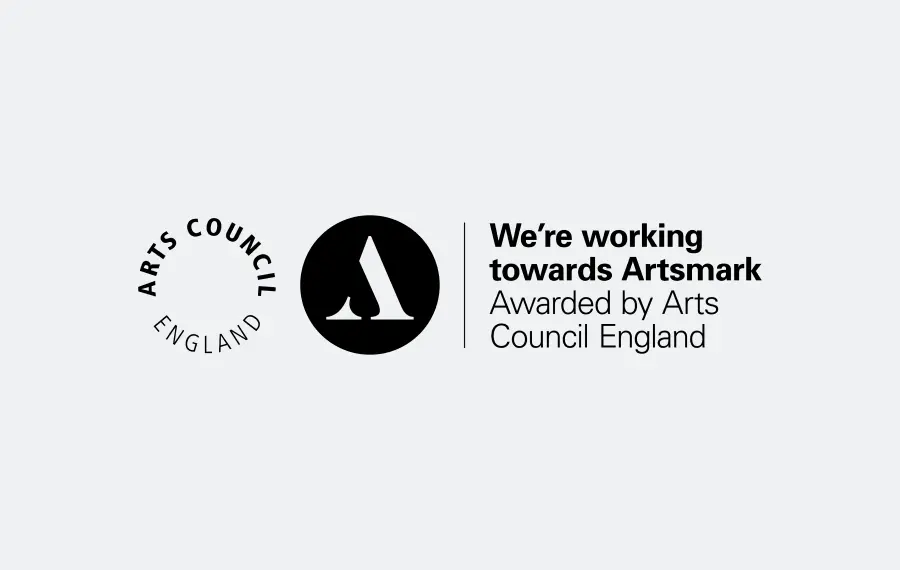 Arts Council England logo next to text: We're working towards Artsmark awarded by Arts Council England.