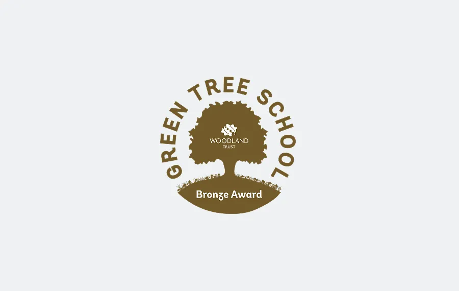 Green Tree School Bronze Award from Woodland Trust featuring a tree silhouette.