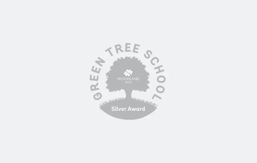 Green Tree School Silver Award from Woodland Trust featuring a tree silhouette.