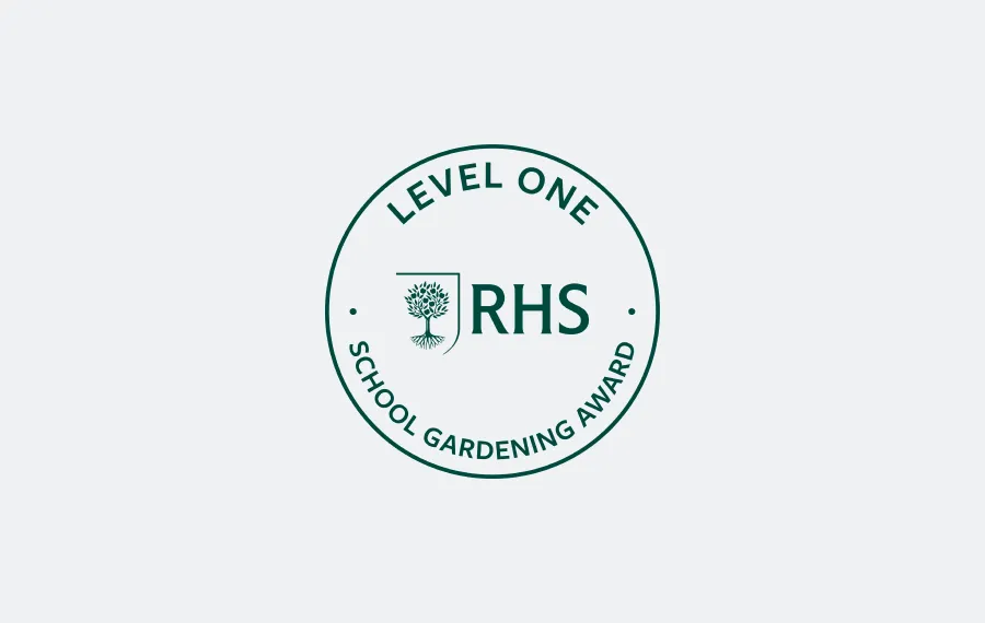 Round RHS Level One School Gardening Award badge with tree emblem in centre.